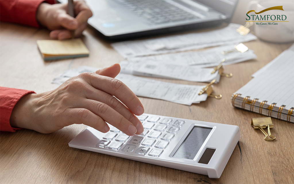 Close up woman hands calculates on calculator for personal finance